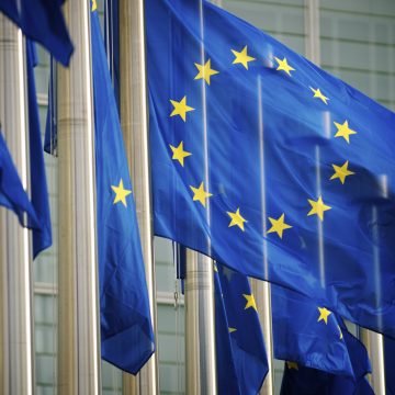 EU Flags Flying at the European Commission Building, Home of the EU Accessibility Act 2025